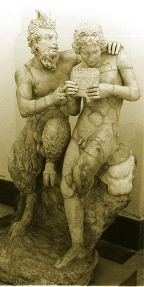 Pan teaching his eromenos, the shepherd
            Daphnis, to play the panpipes 2nd century AD Roman copy of
            Greek original ca. 100 BC attributed to Heliodorus (found in
            Pompeii)